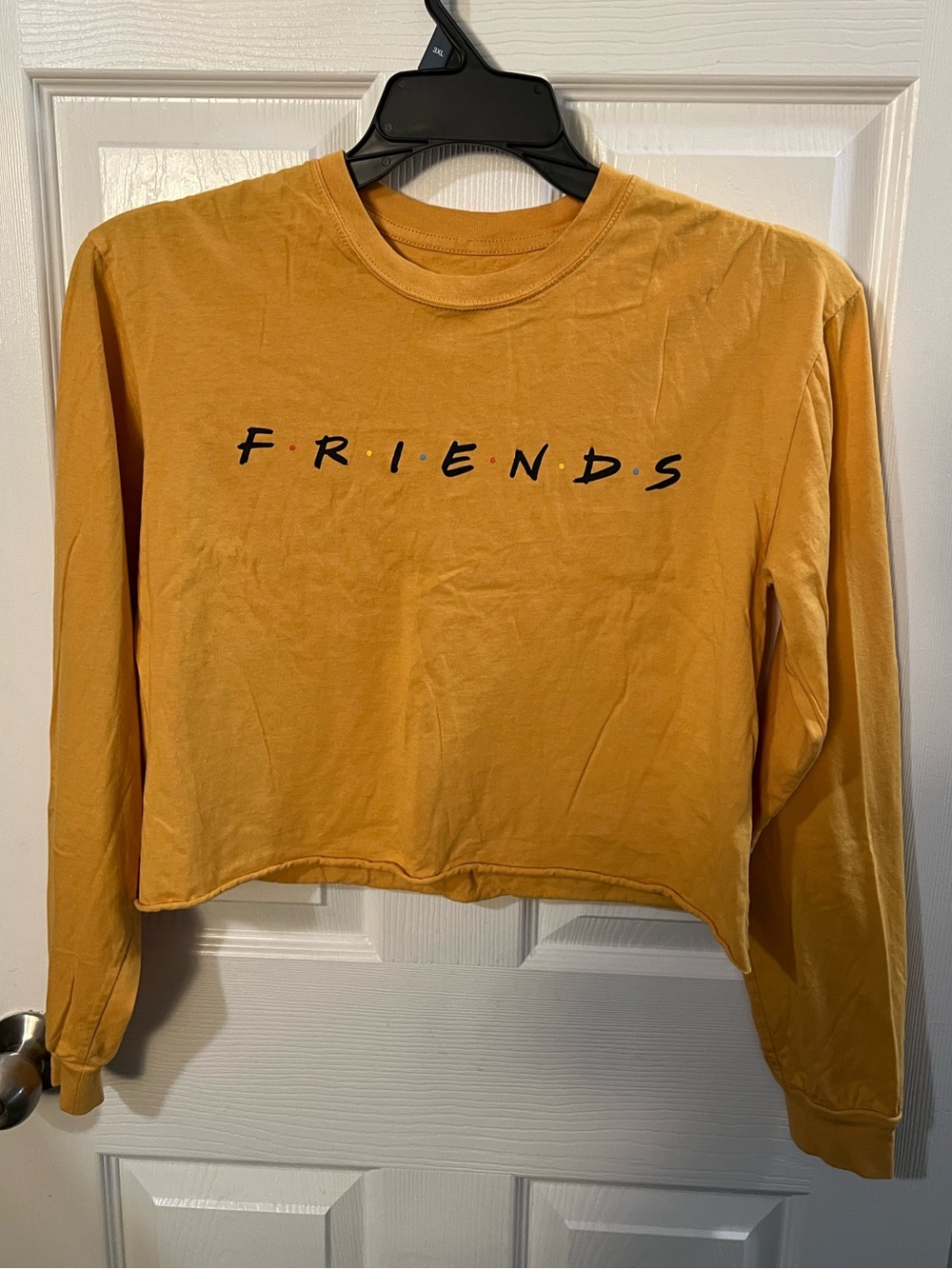 Friends TV show mustard yellow long-sleeve crop top. Tv series, classic, 90s